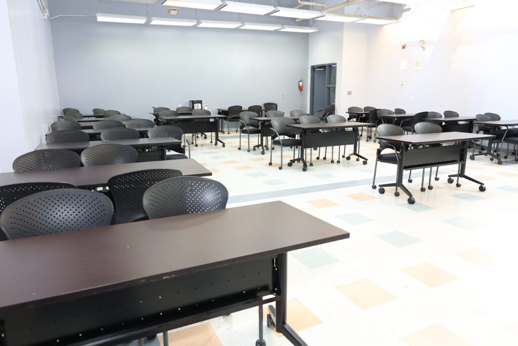 A large classroom with rows of desks