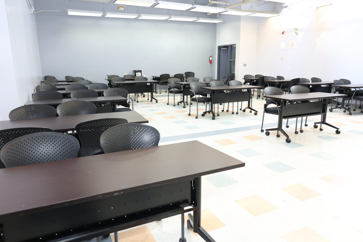 A large classroom at MCC with rows of desks