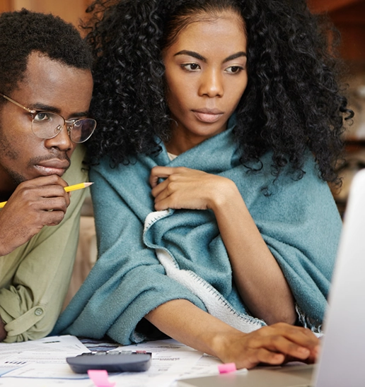 Two students working through accounting material together
