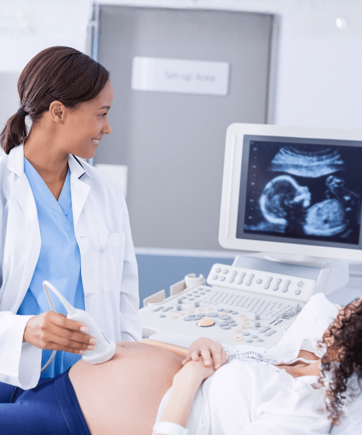 A sonographer performing an ultrasound scan